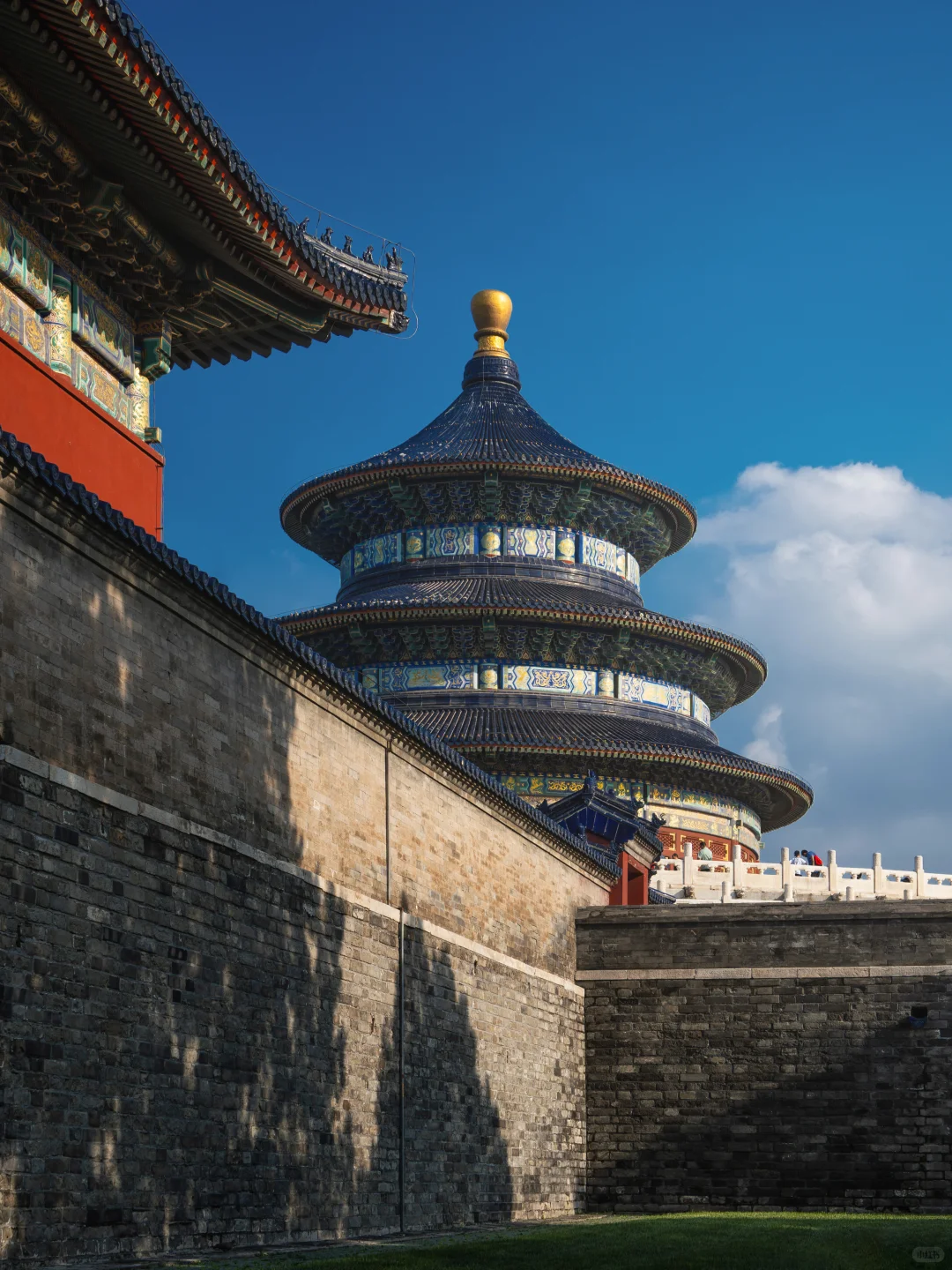 Tourist photographing Beijing temple with backpack