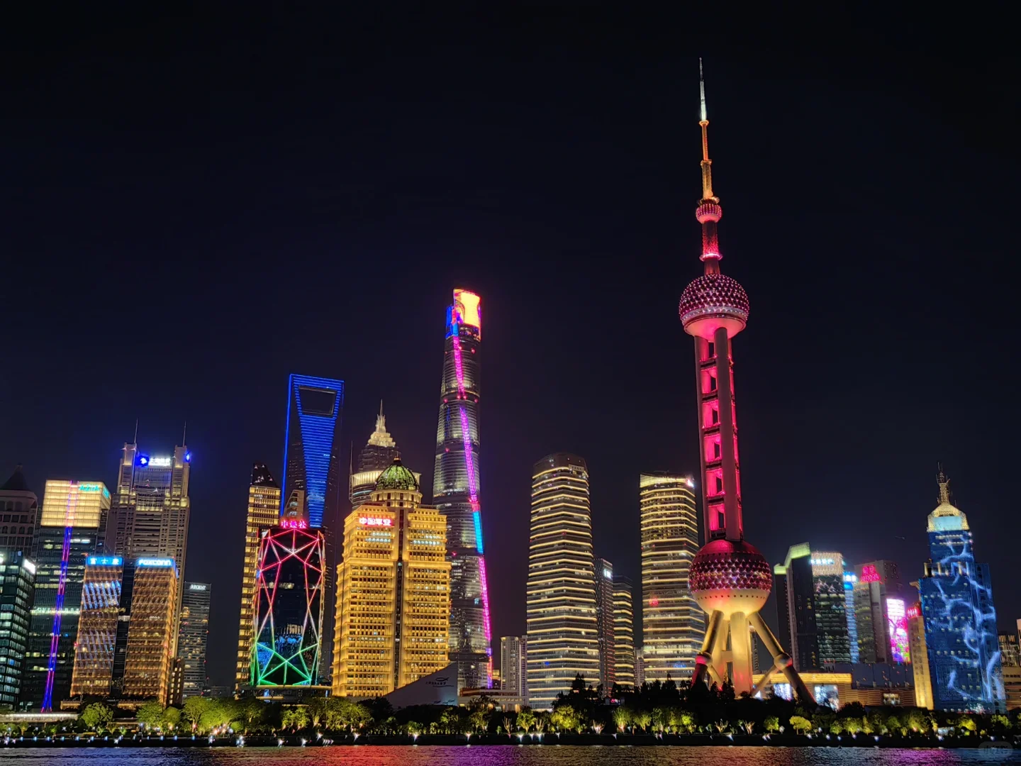 Crowds of people gathered along the north beach in Shanghai at night