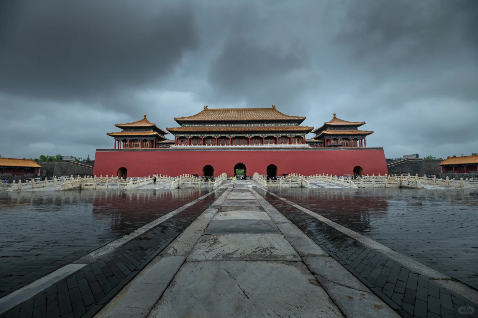 Empty rain-soaked stone pathway at Forbidden City