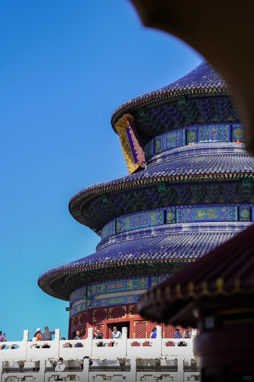 Detailed rooftop carvings seen during morning light from North Heaven Gate