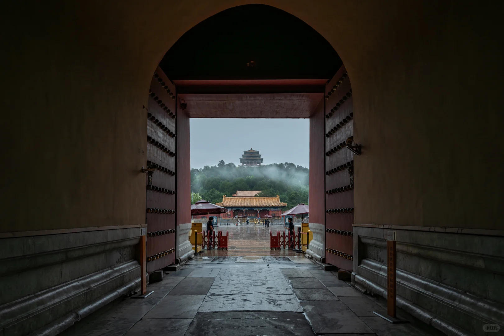 Forbidden City gate in gentle rain with soft light
