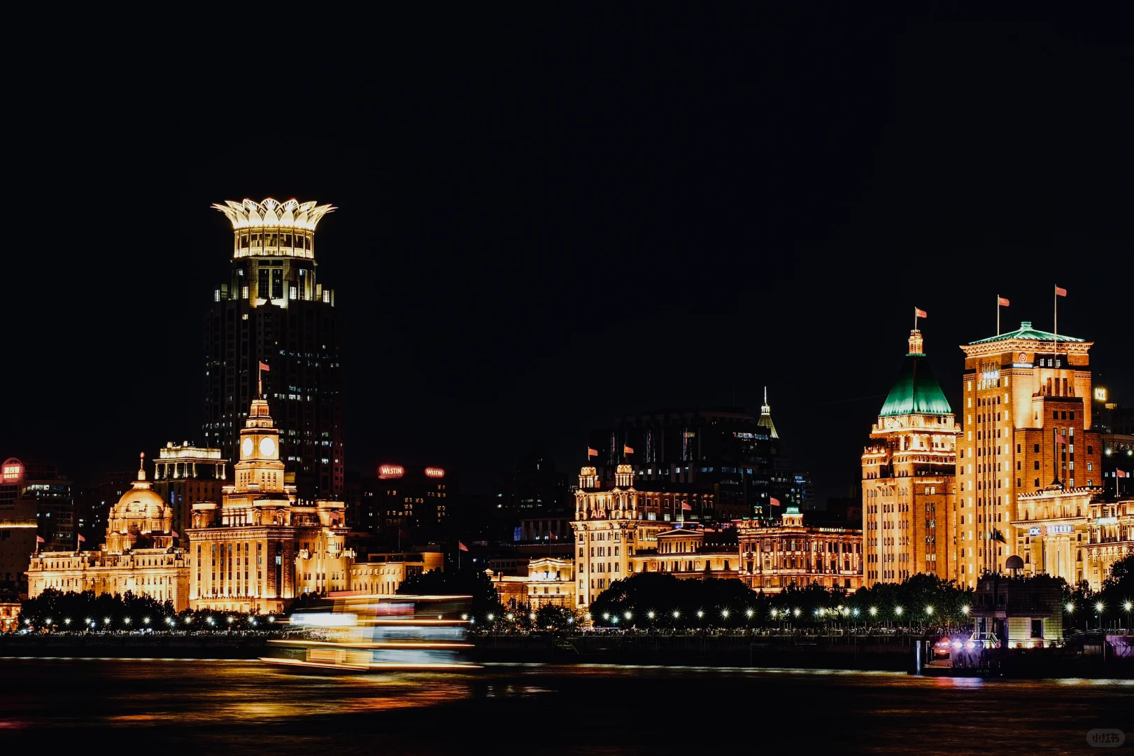 Shanghai illuminated skyline from the riverside at night