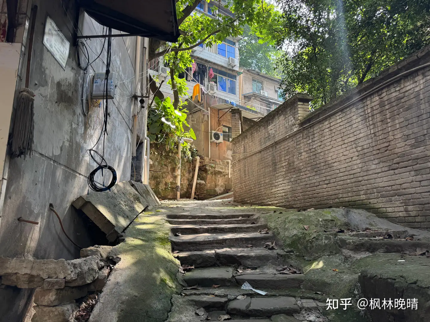A narrow Chongqing stair street between old walls